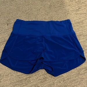 Sped up high rise short 2.5, size 8. Blue color